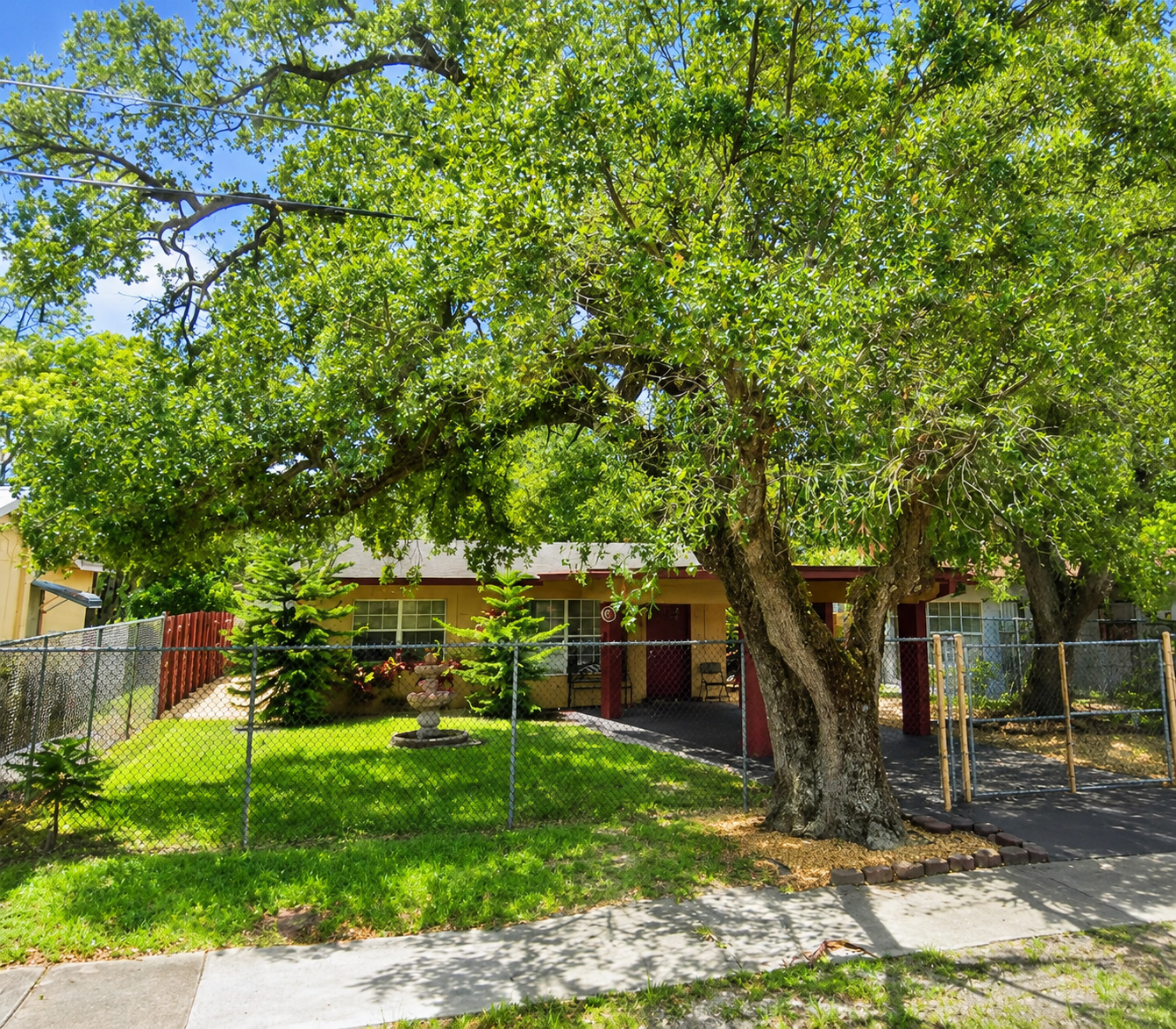 wide_daytime_residential_street_view_a_single_sto